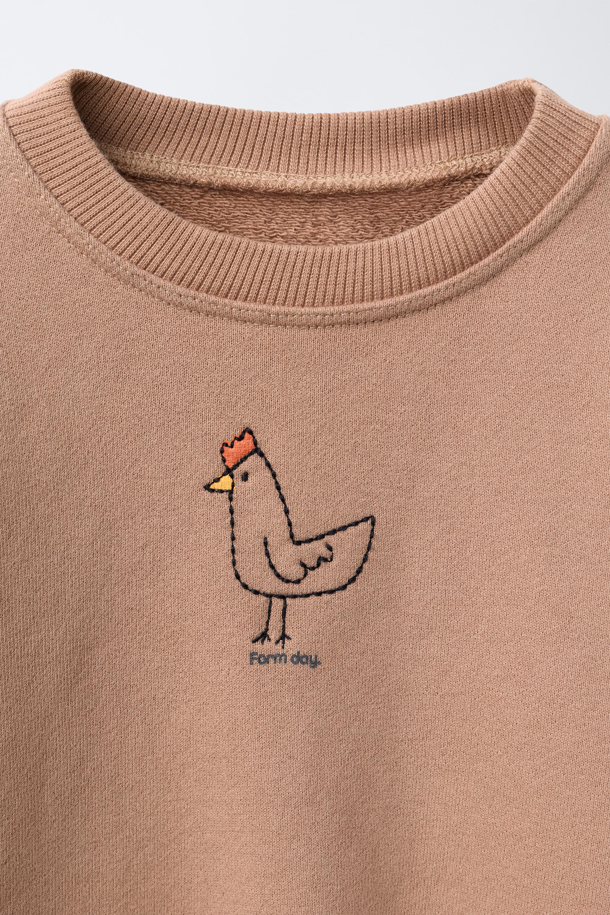 SWEAT COQ BRODÉ